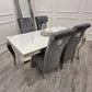Louis Black Marble Dining Table With Black Sofia Chairs With Lion Knocker